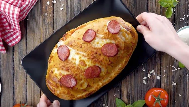 This is such a beautiful pizza on a loaf in the oven.