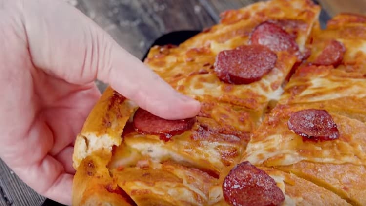 We cut the dish hot into pieces and try.