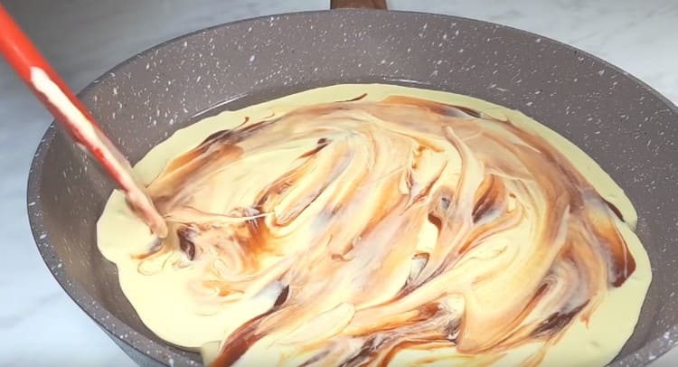 Distribute ketchup on top of the dough.