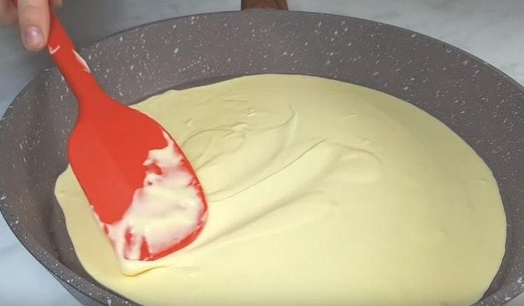 Distribute the dough evenly over the pan.