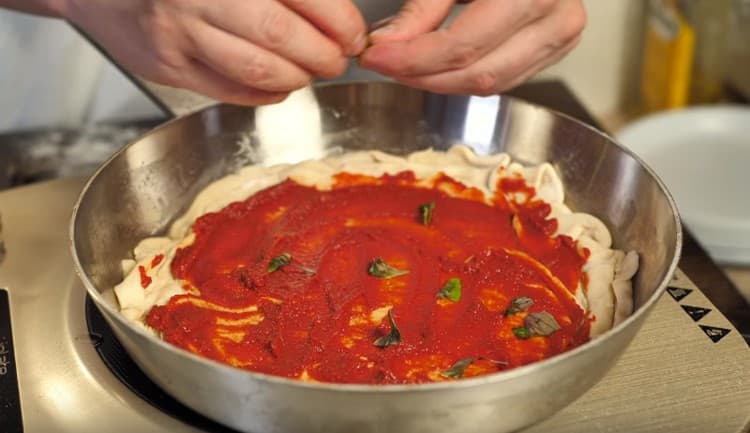 Sprinkle the blank with fresh basil leaves.
