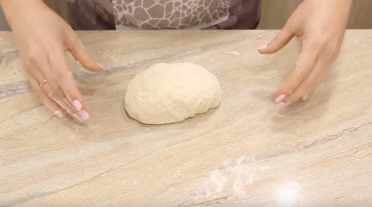 Knead the dough with your hands.
