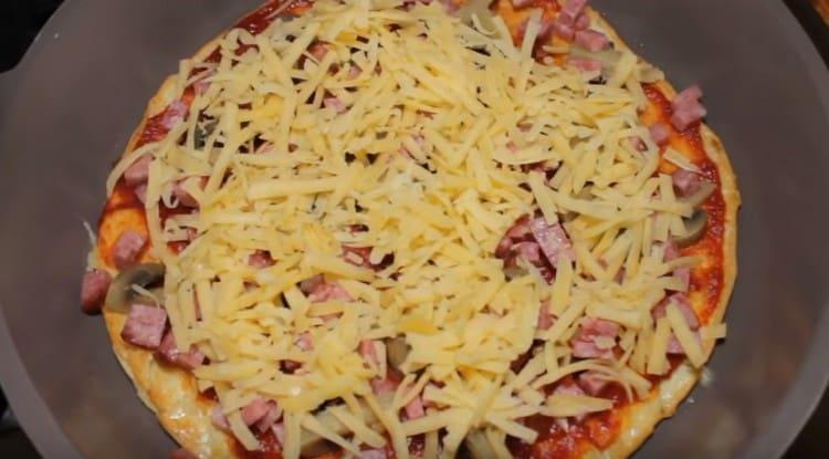 Next, lay out the cheese and sausage.