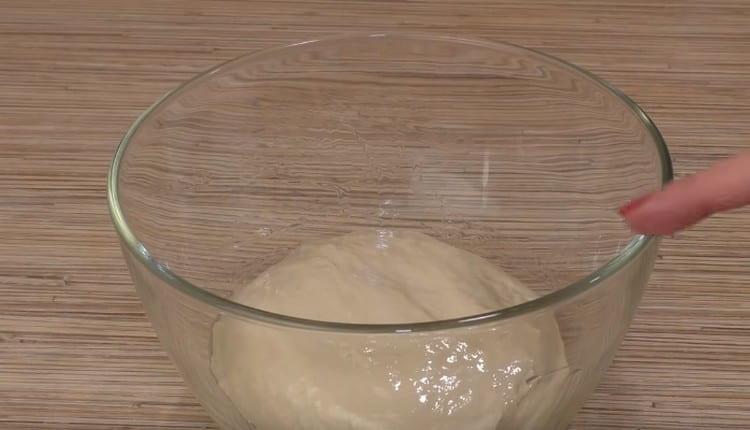 Leave the dough in a warm place to rise.