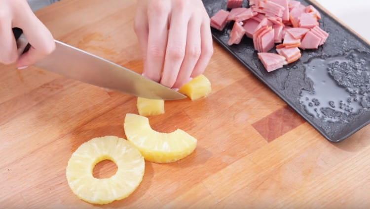 We cut canned pineapples into slices.