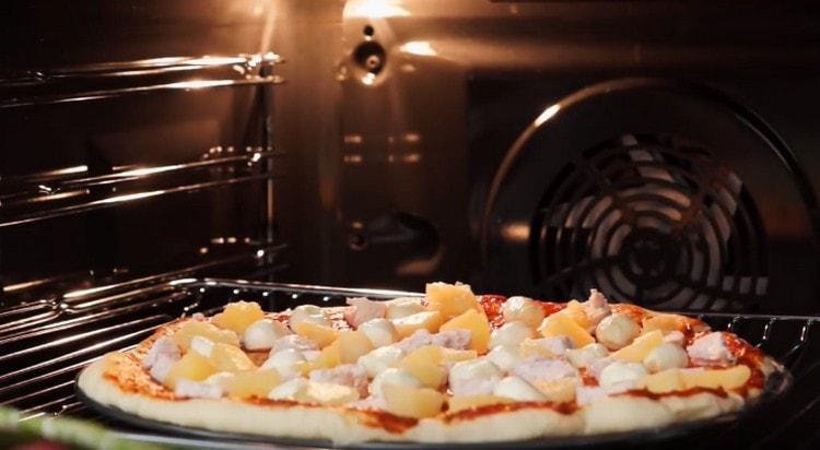 We send pizza to the oven.