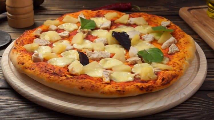 Try this recipe and try to make such a delicious pizza with pineapple and chicken.