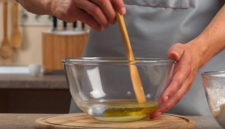 In a separate bowl, mix the olive oil with salt and sugar.