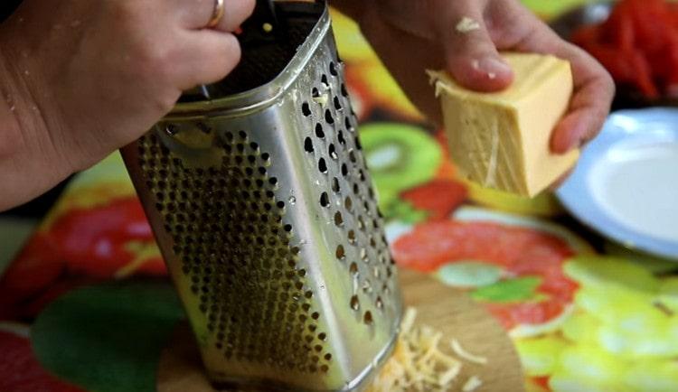 Grate hard cheese.