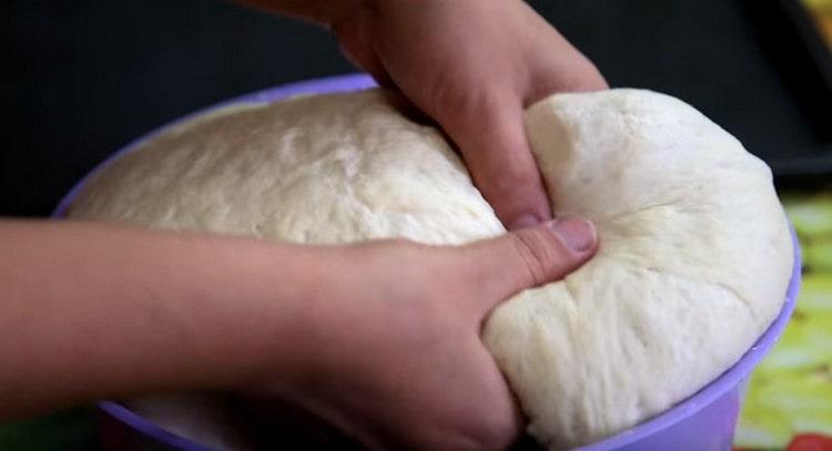 We crush the dough slightly.