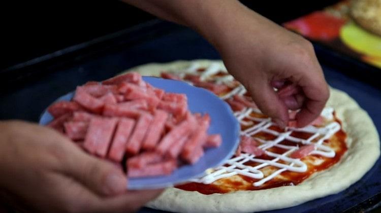 We lay sausage on top of the sauces.