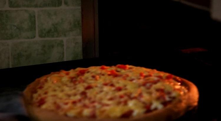 We send pizza to the oven and bake until the sides are lightly browned.