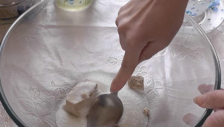 Pound yeast with sugar.