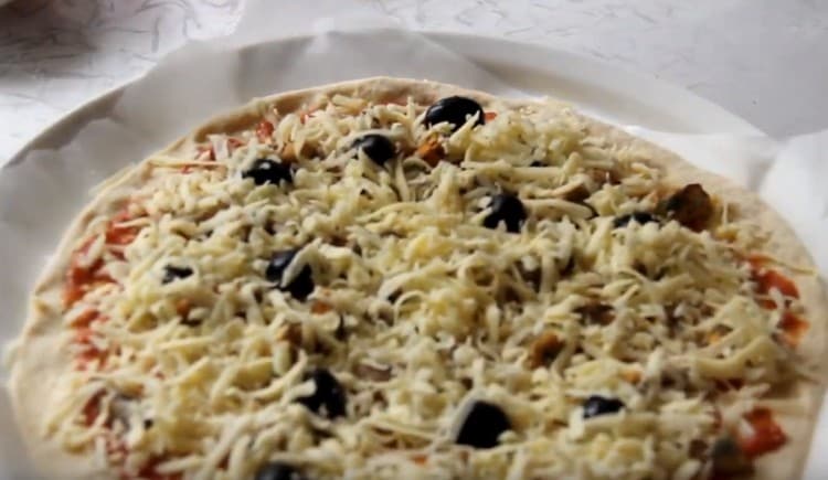 We shift the blank on parchment onto a baking sheet.