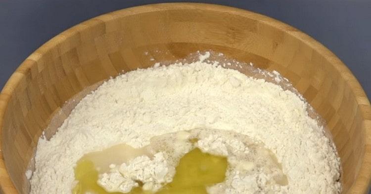 To prepare the dough, mix flour, yeast, water, salt, olive oil.
