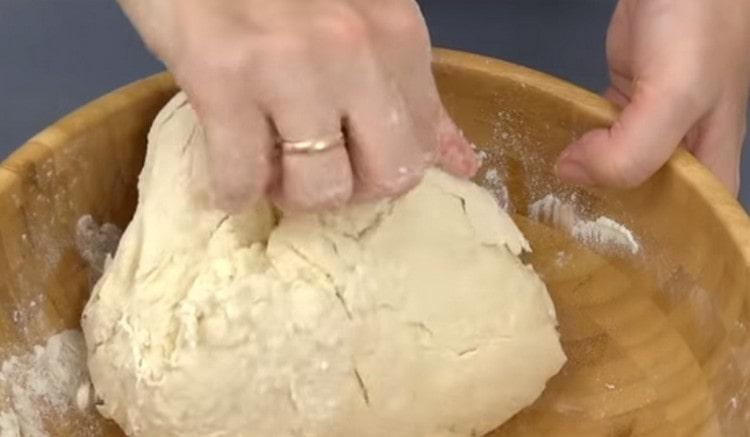 Knead the soft dough.