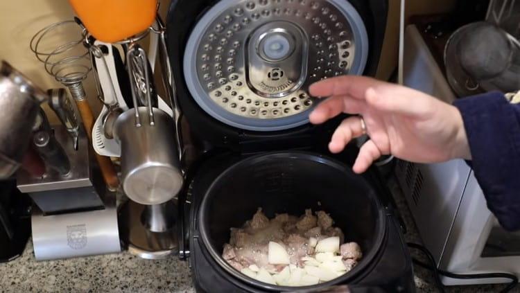 Add onion to pork, mix.