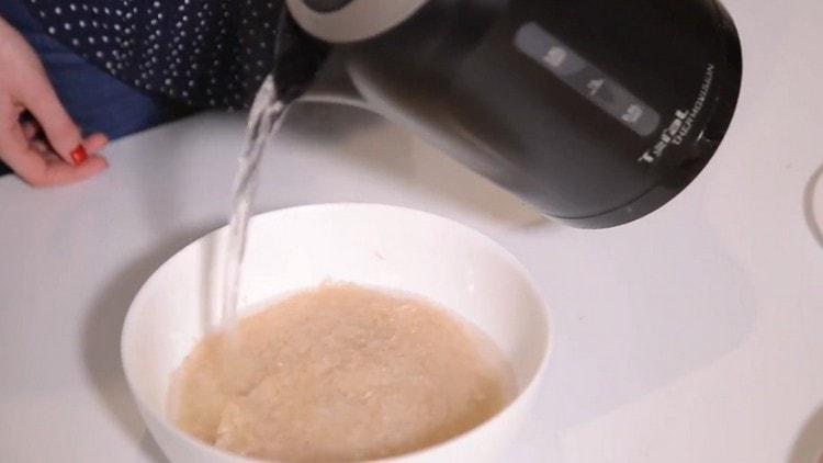 Pour rice in a bowl with water.