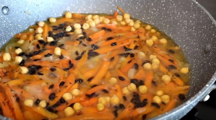 Add spices, as well as previously soaked chickpeas.