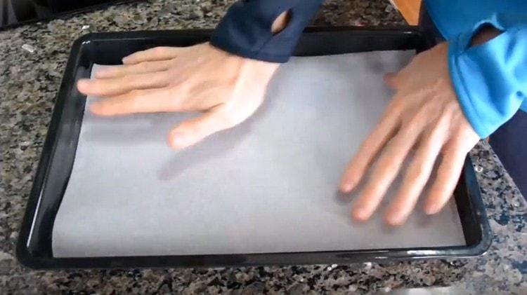 Cover the baking sheet with parchment.