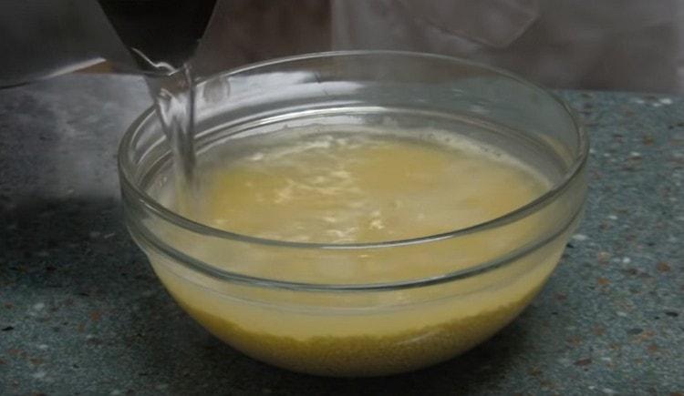 First, wash the millet and pour it with boiling water.