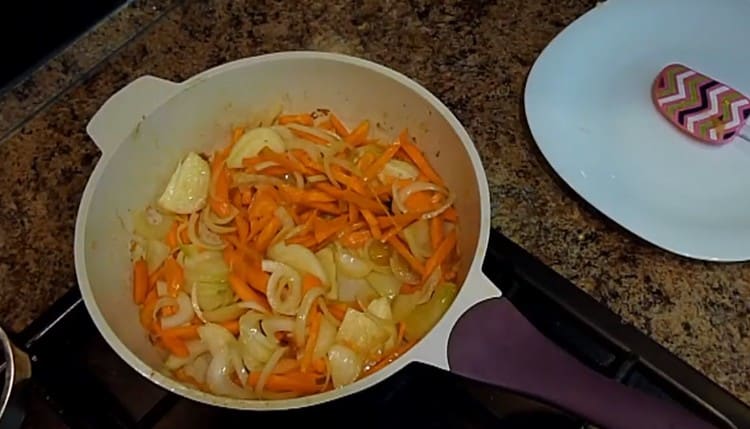 Fry separately chopped onions with carrots in a pan.