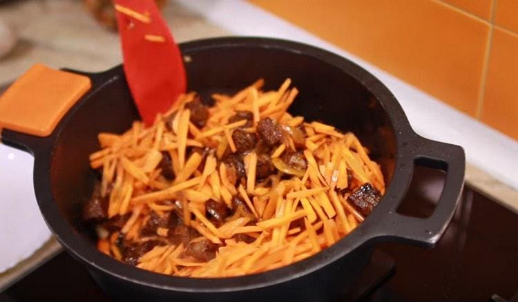 Add carrots, simmer it until soft.