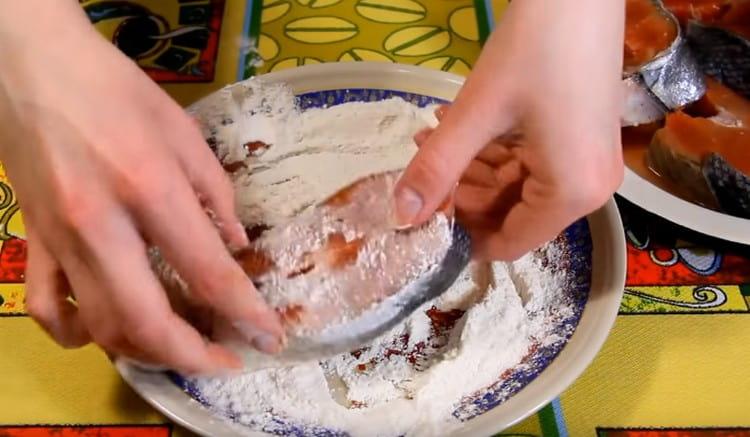 Roll each piece of fish in flour.
