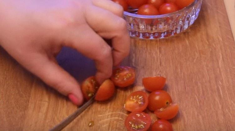 Halve the cherry tomatoes.