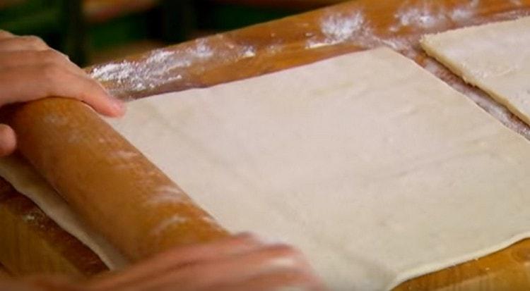 Roll out the puff pastry a little.