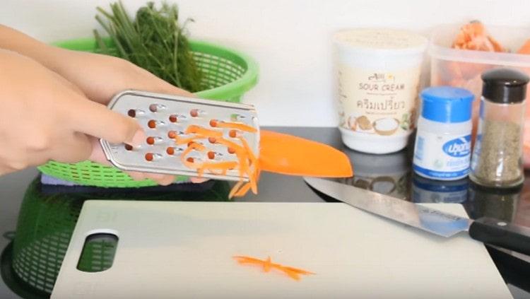 Three carrots on a coarse grater.