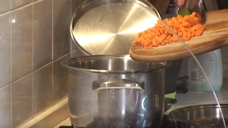 Put the carrots in a pot of boiling water.
