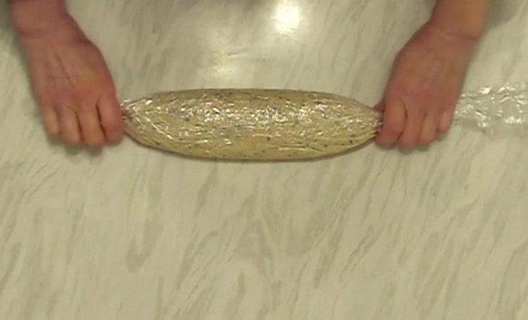 Wrap the fillet in a film in the form of candy.