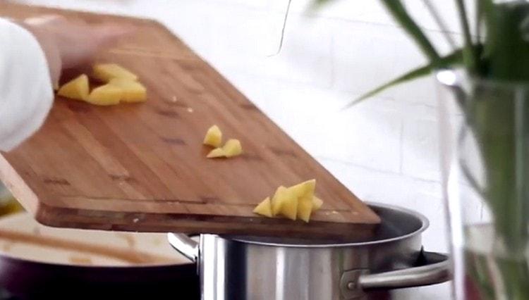 We shift the potatoes and frying into the pan.