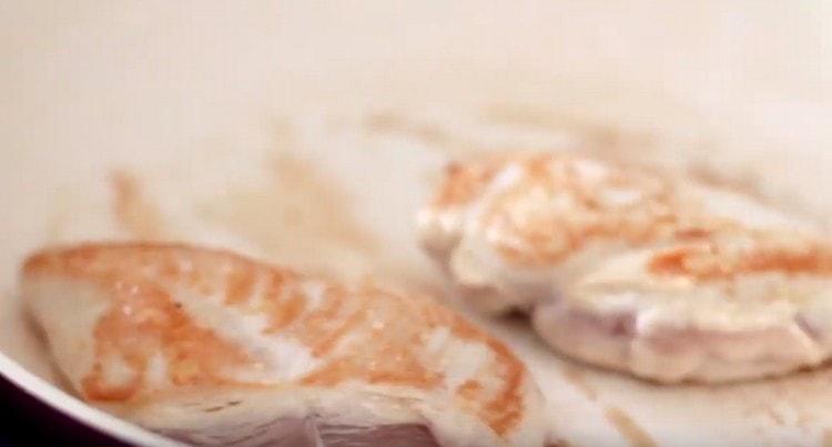 Fry the chicken on both sides in a pan until golden brown.