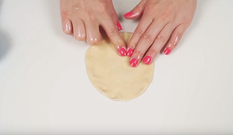 Each ball of dough needs to be carefully stretched out by hand