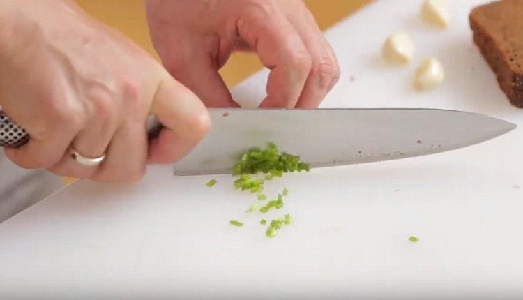 Finely chop the celery stalks.