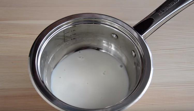 In a stewpan, heat the milk.