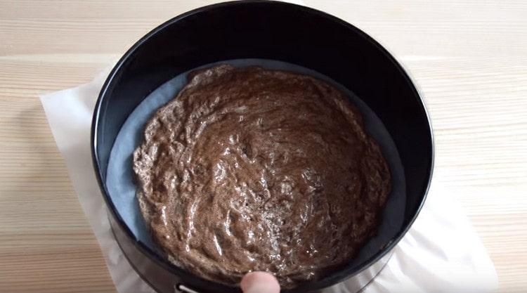 We spread the dough in a parchment-covered form.