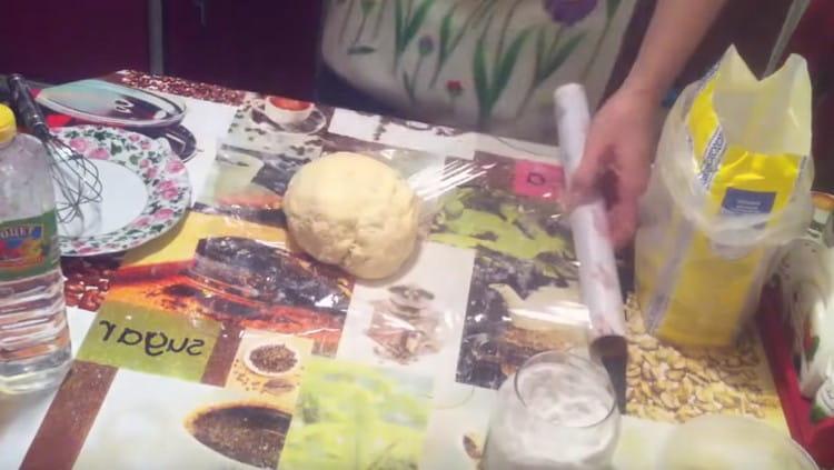 The finished dough needs to be wrapped in cling film and sent to the refrigerator.