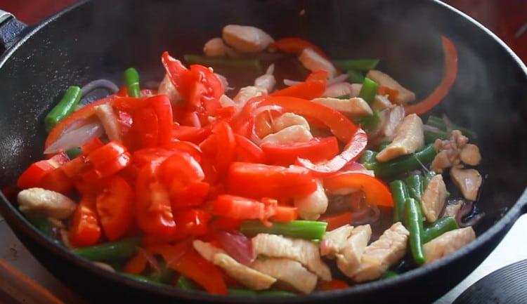 Add tomatoes to the pan.