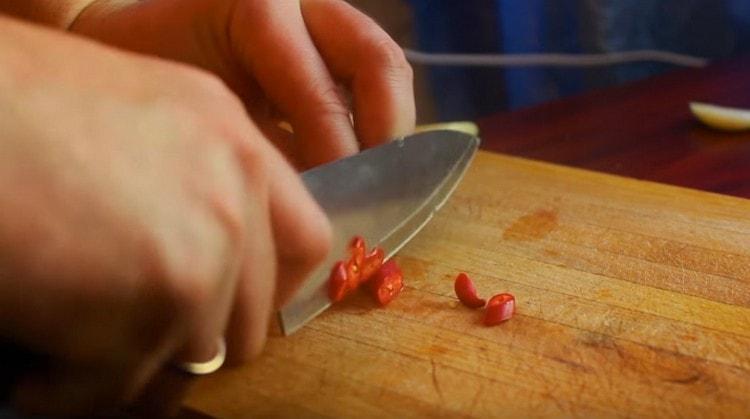 Grind red hot pepper.