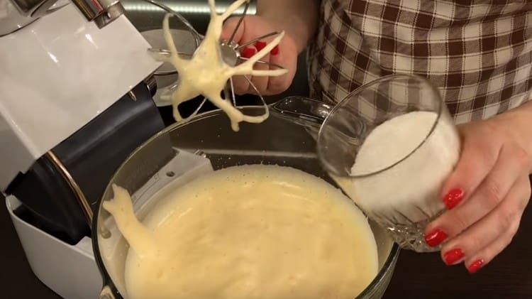 Add sugar, a pinch of salt to the eggs and whisk more.