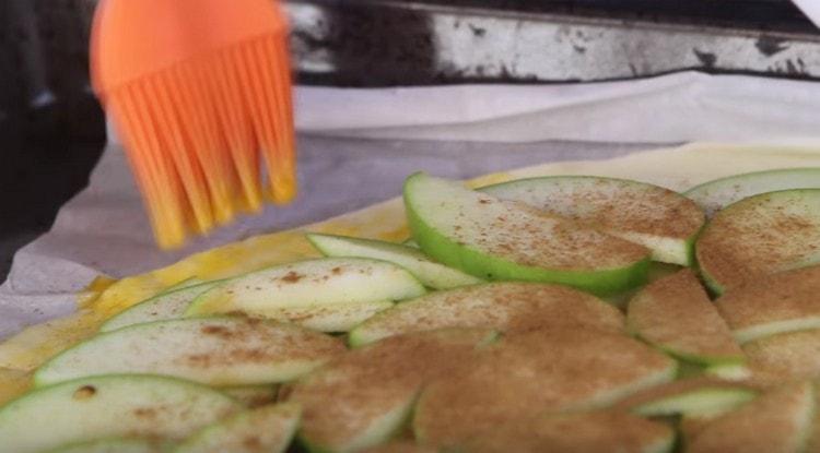Beat the yolk and grease the edges of the dough with it.