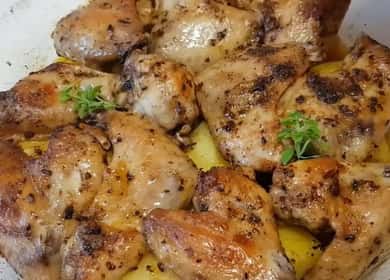 Oven juicy chicken wings with potatoes, baked in the oven