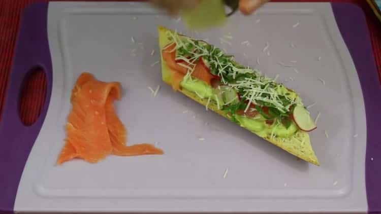 To make sandwiches with avocado and red fish, grate the parmesan