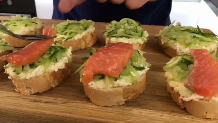 To make sandwiches with red fish, collect all the ingredients on a baguette