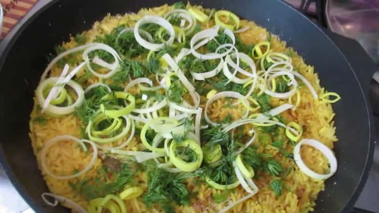 chop the greens to prepare the side dish for fried fish