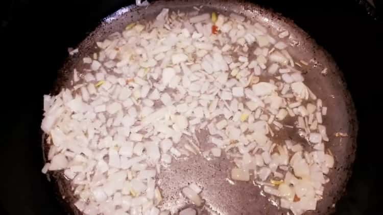 To prepare a yeast pie with meat, fry the onion