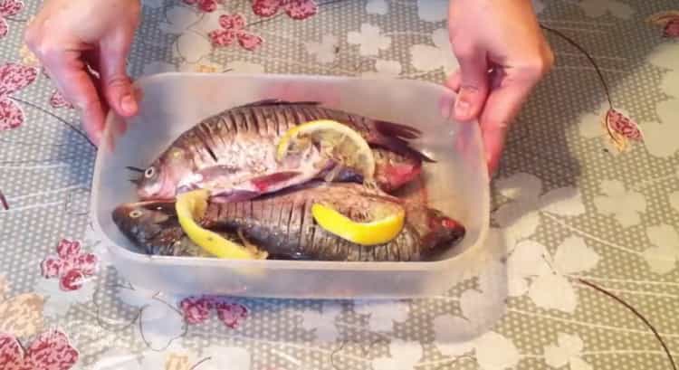 To prepare fried fish, put the fish in a container